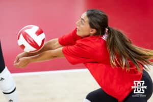 Nebraska alumnus Kenzie (Maloney) Hoppes (11) makes a pass against Nebraska Cornhuskers in the first set during the Nebraska alumni match on Saturday, Aug. 16, 2025 in Lincoln, Nebraska. Photo by John S. Peterson.