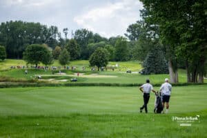 Peter Kuest and his caddie are waiting for the group ahead of them to finish on the 15th green during the Pinnacle Bank Championship on Sunday, Aug. 10, 2025, in Elkhorn, Nebraska. Photo by John S. Peterson.