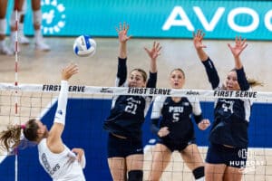 Creighton Bluejay Ava Marti (8) spikes the ball against Penn State Nittany Lions Maggie Mendelson (44) and Izzy Starck (21) during the AVAC First Serve volleyball match on Saturday, Aug. 23, 2025 in Lincoln, Nebraska. Photo by John S. Peterson.