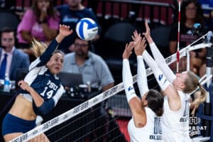 Penn State Nittany Lion Caroline Jurevicius (14) spikes the ball against Creighton Bluejays Eloise Brandewie (10) and Annalea Maeder (17) in the second set during the AVAC First Serve volleyball match on Saturday, Aug. 23, 2025 in Lincoln, Nebraska. Photo by John S. Peterson.