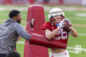Nebraska Cornhusker Roman Mangini (26) makes a catch with coach Daikiel Shorts challenging him during Nebraska’s football open scrimmage on Saturday, Aug. 2, 2025 in Lincoln, Nebraska. Photo by John S. Peterson.