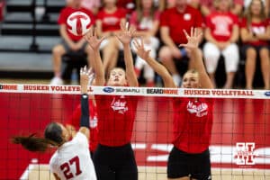 Nebraska alumni Lindsay Krause (22) and Leyla Balckwell (15) atempt to block Nebraska Cornhusker Harper Murray (27) in the first set during the Nebraska alumni match on Saturday, Aug. 16, 2025 in Lincoln, Nebraska. Photo by John S. Peterson.