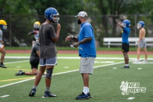 Neils Paul talks with a player during Omaha North football practice on August 11th, 2025 in Omaha Nebraska. Photo by Brandon Tiedemann.