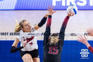 Nebraska Cornhusker Allie Sczech (3) spikes the ball against Stanford Cardinal Ipar Kurt (15) during the AVAC First Serve volleyball match on Sunday, Aug. 24, 2025 in Lincoln, Nebraska. Photo by John S. Peterson.
