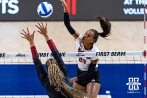 Nebraska Cornhusker Harper Murray (27) spikes the ball against Stanford Cardinal Jordyn Harvey (5) in the second set during the AVAC First Serve volleyball match on Sunday, Aug. 24, 2025 in Lincoln, Nebraska. Photo by John S. Peterson.