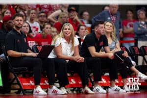 Part of the Nebraska Cornhuskers coaching staff Nate Wilson, Dani Busboom Kelly, Brennan Hager, and Jolene Emricson watching the action on the court against the Nebraska alumni during the Nebraska alumni match on Saturday, Aug. 16, 2025 in Lincoln, Nebraska. Photo by John S. Peterson.