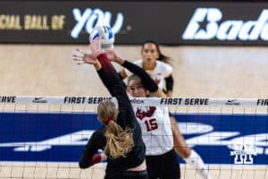 Nebraska Cornhusker Andi Jackson (15) blocks a spike from Stanford Cardinal Lizzy Andrew (11) in the second set during the AVAC First Serve volleyball match on Sunday, Aug. 24, 2025 in Lincoln, Nebraska. Photo by John S. Peterson.