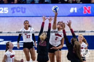 Nebraska Cornhusker Rebekah Allick (5) hits the ball over Stanford Cardinal Erika Sayer (22) and Jordyn Harvey (5) in the second set during the AVAC First Serve volleyball match on Sunday, Aug. 24, 2025 in Lincoln, Nebraska. Photo by John S. Peterson.