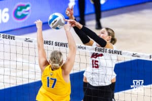 Nebraska Cornhusker Andi Jackson (15) wins the battle against Pittsburgh Panther Brooke Mosher (17) during the AVAC Showcase volleyball match on Friday, Aug. 22, 2025, in Lincoln, Nebraska. Photo by John S. Peterson.