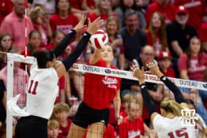 Nebraska alumnus Lauren Stivrins (26) spikes the ball against Nebraska Cornhuskers Teraya Sigler (11) and Andi Jackson (15) in the second set during the Nebraska alumni match on Saturday, Aug. 16, 2025 in Lincoln, Nebraska. Photo by John S. Peterson.