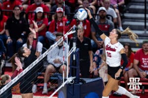 Nebraska Cornhusker Andi Jackson (15) spikes the ball against the Stanford Cardinals in the second set during the AVAC First Serve volleyball match on Sunday, Aug. 24, 2025 in Lincoln, Nebraska. Photo by John S. Peterson.