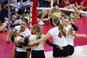 Nebraska Cornhusker Teraya Sigler (11) hugs Olivia Mauch (10) after scoring a point against the Nebraska alumni in the second set during the Nebraska alumni match on Saturday, Aug. 16, 2025 in Lincoln, Nebraska. Photo by John S. Peterson.