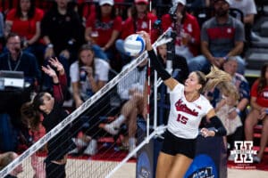 Nebraska Cornhusker Andi Jackson (15) spikes the ball against the Stanford Cardinals in the second set during the AVAC First Serve volleyball match on Sunday, Aug. 24, 2025 in Lincoln, Nebraska. Photo by John S. Peterson.
