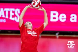 Nebraska alumnus Kelly (Hunter) Natter (3) sets the ball against the Nebraska Cornhuskers in the third set during the Nebraska alumni match on Saturday, Aug. 16, 2025 in Lincoln, Nebraska. Photo by John S. Peterson.