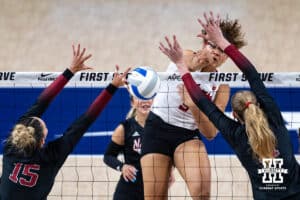 Nebraska Cornhusker Rebekah Allick (5) spikes the ball against Stanford Cardinal Ipar Kurt (15) and Lizzy Andrew (11) in the third set during the AVAC First Serve volleyball match on Sunday, Aug. 24, 2025 in Lincoln, Nebraska. Photo by John S. Peterson.