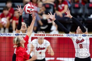 Nebraska alumnus Jordan Larson (10) tips the ball against Nebraska Cornhuskers Allie Sczech (3) and Kenna Cogill (8) in the third set during the Nebraska alumni match on Saturday, Aug. 16, 2025 in Lincoln, Nebraska. Photo by John S. Peterson.