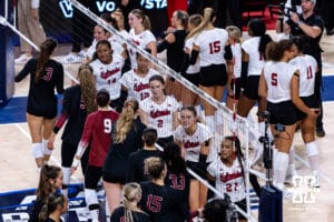 Nebraska Cornhuskers and Stanford Cardinals shake hand after the Huskers take the win during the AVAC First Serve volleyball match on Sunday, Aug. 24, 2025 in Lincoln, Nebraska. Photo by John S. Peterson.