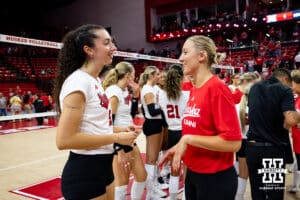 Nebraska Cornhusker Virginia Adriano (9) and Nebraska alumnus Jordan Larson (10) talk after the match during the Nebraska alumni match on Saturday, Aug. 16, 2025 in Lincoln, Nebraska. Photo by John S. Peterson.