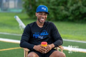 Head Coach Allen Burrell laughs before Millard North football practice on Saturday, August 16th, 2025 in Omaha, Nebraska. Photo by Brandon Tiedemann.