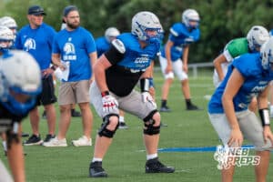 Matt Erickson warms up during Millard North football practice on Saturday, August 16th, 2025 in Omaha, Nebraska. Photo by Brandon Tiedemann.
