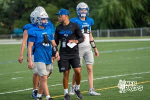 Head Coach Allen Burrell talks with players during Millard North football practice on Saturday, August 16th, 2025 in Omaha, Nebraska. Photo by Brandon Tiedemann.