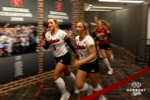 Nebraska Cornhuskers Laney Choboy (6) and Keri Leimbach (1) lead the Huskers out to the court to take on the Michigan Wolvines during a college volleyball match on Wednesday, September 24, 2025, in Lincoln, Nebraska. Photo by John S. Peterson.