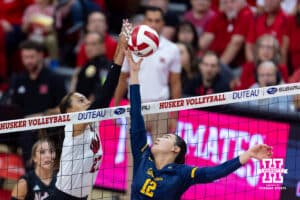 Nebraska Cornhusker Harper Murray (27) joust with California Golden Bear Natalie Lau (12) in the first setduring a college volleyball match on Sunday, September 7, 2025 in Lincoln, NE. Photo by John S. Peterson.