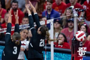 Nebraska Cornhusker Teraya Sigler (11) spikes the ball against Grand Canyon Lopes Hayden Goodman (3) and Lope Bella Nunez (21) in the first set during a college volleyball match on Saturday, September 13, 2025, in Lincoln, Nebraska. Photo by John S. Peterson.