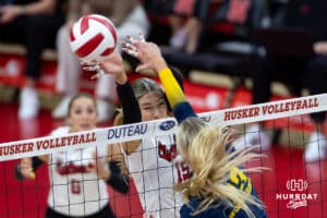 Nebraska Cornhusker Andi Jackson (15) blocks the ball against the Michigan Wolvines in the first set during a college volleyball match on Wednesday, September 24, 2025, in Lincoln, Nebraska. Photo by John S. Peterson.