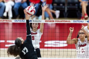 Nebraska Cornhusker Virginia Adriano (9) jumps to try and block Grand Canyon Lope Anaelena Ramirez (17) in the first set during a college volleyball match on Saturday, September 13, 2025, in Lincoln, Nebraska. Photo by John S. Peterson.