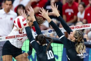 Nebraska Cornhusker Skyler Pierce (21) spikes the ball against Grand Canyon Lopes Aubrey Bellus (10) and Hayden Goodman (3) in the third set during a college volleyball match on Saturday, September 13, 2025, in Lincoln, Nebraska. Photo by John S. Peterson.