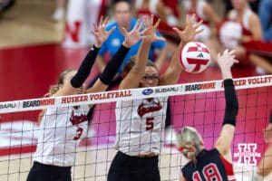 Nebraska Cornhusker Rebekah Allick (5) blocks a spike from Utah Ute Kamryn Gibadlo (18) in the second set during a college volleyball match on Friday, September 12, 2025, in Lincoln, NE. Photo by John S. Peterson.