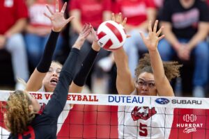 Nebraska Cornhusker middle blocker Rebekah Allick (5) jumps up to block Maryland Terrapin outside hitter Olivia Ruy (19) during a college volleyball match on Saturday, September 27, 2025, in Lincoln, Nebraska. Photo by John S. Peterson.