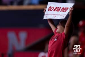 Nebraska Cornhusker fan holds up a sign saying Go Big Red during a college volleyball match on Saturday, September 13, 2025, in Lincoln, Nebraska. Photo by John S. Peterson.