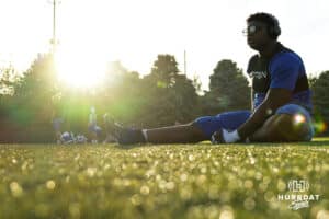 Elisee Ahianti stretches before the Creighton Prep football game vs Fremont on October 10th, 2025 in Omaha, Nebraska. Photo by Drew Balus