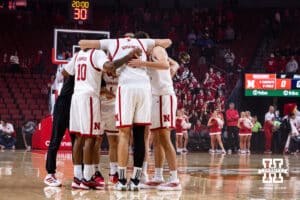 Nebraska Cornhuskers huddle up before the start of a college men’s basketball exhibition game against the Midland Vikings on Monday, October 27, 2025, in Lincoln, Nebraska. Photo by John S. Peterson.