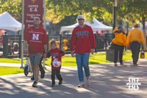Nebraska Cornhuskers fans making their way to the stadium for the college football game against the Minnesota Golden Gophers on Friday, October 17, 2025, in Minneapolis, Minnesota. Photo by John S. Peterson.