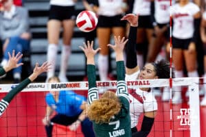 Nebraska Cornhusker outside hitter Teraya Sigler (11) spikes the ball against Michigan State Spartan setter Malayah Long (7) in the first set during a college volleyball match on Saturday, October 25, 2025, in Lincoln, Nebraska. Photo by John S. Peterson.