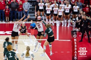 Nebraska Cornhusker outside hitter Harper Murray (27) and middle blocker Rebekah Allick (5) blocks a spike from Michigan State Spartan outside hitter Bianca Mumcular (3) in the first set during a college volleyball match on Saturday, October 25, 2025, in Lincoln, Nebraska. Photo by John S. Peterson.