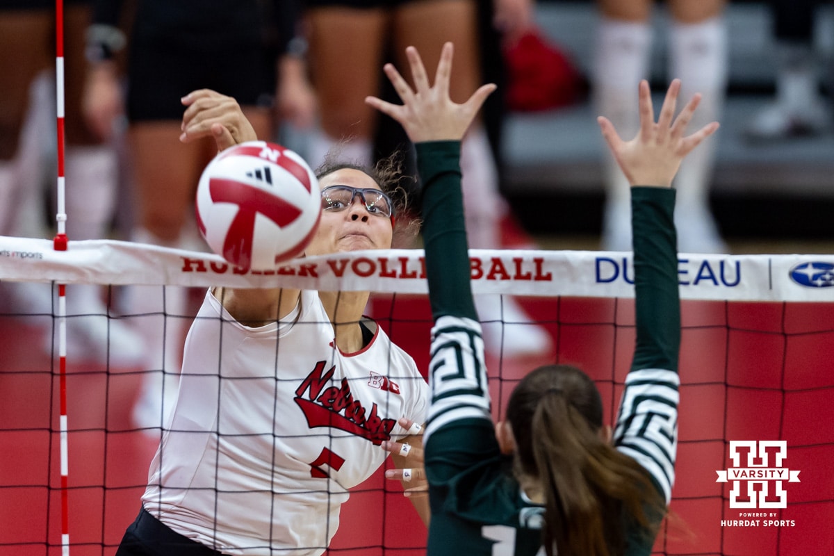 Nebraska Cornhusker middle blocker Rebekah Allick (5) hits the ball down the line against Michigan State Spartan outside hitter Taylah Holdem (14) in the second set during a college volleyball match on Saturday, October 25, 2025, in Lincoln, Nebraska. Photo by John S. Peterson.