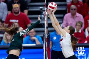 Nebraska Cornhusker setter Bergen Reilly (2) blocks a spike from Michigan State Spartans during a college volleyball match on Saturday, October 25, 2025, in Lincoln, Nebraska. Photo by John S. Peterson.