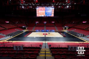 The Nebraska Cornhuskers bring out the design of the court against the Illinois Fighting Illini during a college volleyball match on Thursday, November 6, 2025, in Lincoln, Nebraska. Photo by John S. Peterson.