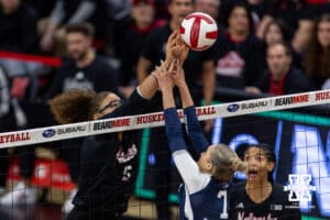 Nebraska Cornhusker middle blocker Rebekah Allick (5) battle at the net against Penn State Nittany Lion setter Addie Lyon (7) in the first set during a volleyball match on Friday, Nov. 28, 2025, in Lincoln, Nebraska. Photo by John S. Peterson.