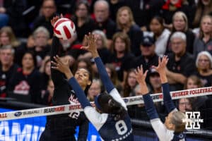Nebraska Cornhusker outside hitter Taylor Landfair (12) spikes the ball against Penn State Nittany Lion middle blocker Gabrielle Nichols (8) in the first set during a volleyball match on Friday, Nov. 28, 2025, in Lincoln, Nebraska. Photo by John S. Peterson.