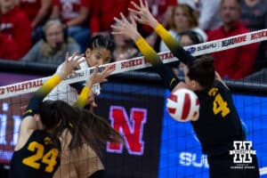 Nebraska Cornhusker outside hitter Taylor Landfair (12) spikes the ball against the Iowa Hawkeyes in the first set during a college volleyball match on Thursday, Nov. 20, 2025, in Lincoln, Nebraska. Photo by John S. Peterson.