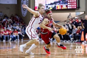 Nebraska Cornhusker guard Sam Hoiberg (1) drbbles the ball against Oklahoma Sooner guard Dayton Forsythe (7) in the first half during a college men’s basketball game on Saturday, Nov 15, 2025, in Sioux Falls, South Dakota. Photo by John S. Peterson.