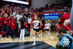 Nebraska Cornhusker libero/defensive specialist Maisie Boesiger (7) lead the Huskers out to the court to take on the Illinois Fighting Illini during a college volleyball match on Thursday, November 6, 2025, in Lincoln, Nebraska. Photo by John S. Peterson.