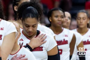 Nebraska Cornhusker outside hitter Teraya Sigler (11) in deep thought during the National Anthem in a college volleyball match against the Illinois Fighting Illini on Thursday, November 6, 2025, in Lincoln, Nebraska. Photo by John S. Peterson.