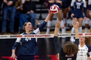 Penn State Nittany Lion middle blocker and former Husker Maggie Mendelson (44) hits the ball against Nebraska Cornhusker middle blocker Rebekah Allick (5) in the second set during a volleyball match on Friday, Nov. 28, 2025, in Lincoln, Nebraska. Photo by John S. Peterson.