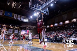 Nebraska Cornhusker forward Berke Buyuktuncel (9) makes a lay up against Oklahoma Sooner guard Xzayvier Brown (1) int the first half during a college men’s basketball game on Saturday, Nov 15, 2025, in Sioux Falls, South Dakota. Photo by John S. Peterson.